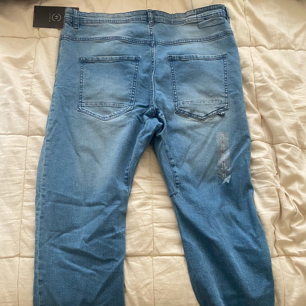 Distressed blue jeans